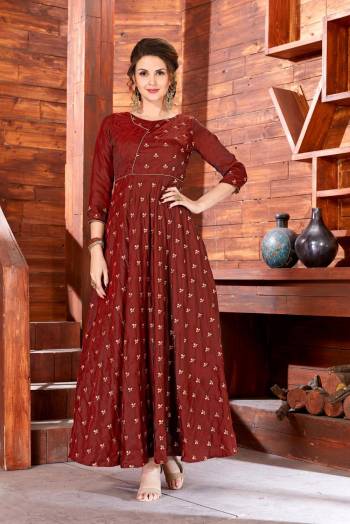 Flaunt Your Rich And Elegant Taste Wearing This Designer Floor Length Readymade Gown In Brown Color Fabricated On Art Silk Beautified With Jari Embroidered Small Motifs All Over It. This Simple And Elegant Looking Dress Will Earn You Lots Of Compliments From Onlookers.