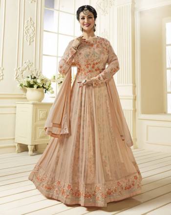 A Must Have Shade In Every Womens Wardrobe Is Here With This Designer Floor Length Suit In Peach Color Paired With Peach Colored Bottom And Dupatta. It Top Is Fabricated On Georgette Paired With Santoon Bottom And Chiffon Dupatta. It Has Very Pretty Satin Fabricated Floral Inner. Buy Now.