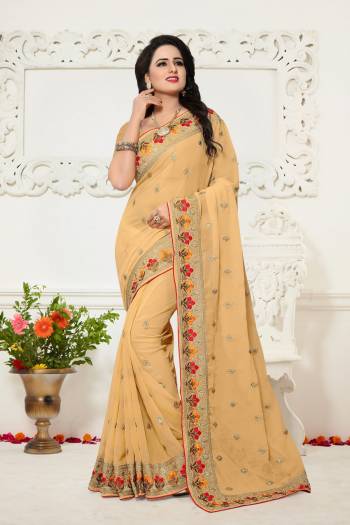 Adorn a Pretty Look Wearing this Designer Saree In Beige Color Paired With Beige Colored Blouse. This Saree And Blouse are Fabricated On Georgette Beautified With Multi Colored Thread Work . Buy This Saree Now.