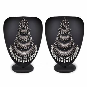 Grab This Common Color That Goes With All. Pair This Attractive Pair Of Earrings In Silver Color Beautified With Black Colored Stones With Any Colored Ethnic Attire. These Pair Of Earrings Will earn You Lots Of Compliments From Onlookers.