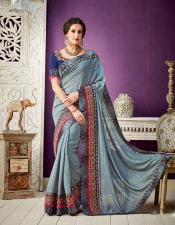 Define elegance and simplicity in this timeless  steel grey and navy saree with ornate embroidery details. Look even more refined by adding kunal layered necklace to the look 