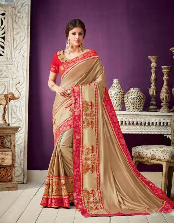 Let the luxury of red-and-gold leave you spoilt for choice. Look magnificent in the elephant-motif enhanced saree . 