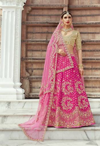 Lavish and opulent, this magenta lehenga will lead your ethnic ensemble in absolute style. It is made with shiny art silk in a scallop border. The lehenga comes along with a heavily embroidered blouse with two dupatta's.
