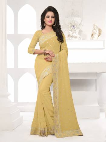 Featuring An Eye Catching design with This Beautiful Designer Saree In Beige Color Paired With Beige Colored Blouse. This Saree And Blouse are Fabricated On Georgette Beautified With Attractive Embroidery. This Pretty Design Is Available In Many Colors.