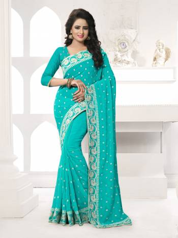 Featuring An Eye Catching design with This Beautiful Designer Saree In Turquoise Blue Color Paired With Turquoise Blue Colored Blouse. This Saree And Blouse are Fabricated On Georgette Beautified With Attractive Embroidery. This Pretty Design Is Available In Many Colors.