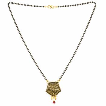 Grab This Pretty Simple Mangalsutra For Your Daily Wear In Golden Color With A Small Hanging Stone. This Mangalsutra Can Be Paired With Any Attire. Buy Now.