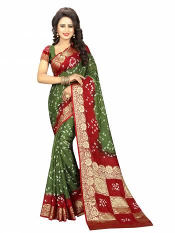 Add This Bandhani Printed Saree To Your Wardrobe In Olive Green And Maroon Color Paired With Olive Green Colored Blouse. This Art Silk Fabricated Saree Ensures Superb Comfort And Earn You Lots Of Compliments From Onlookers.