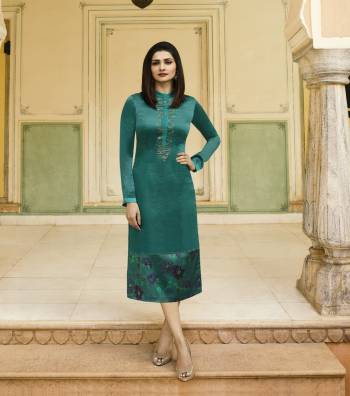 Add This New Shade To Your Wardrobe In Blue With This Pretty Readymade Teal Blue Colored Kurti Fabricated On Satin Beautified With Prints And Stone Work. 