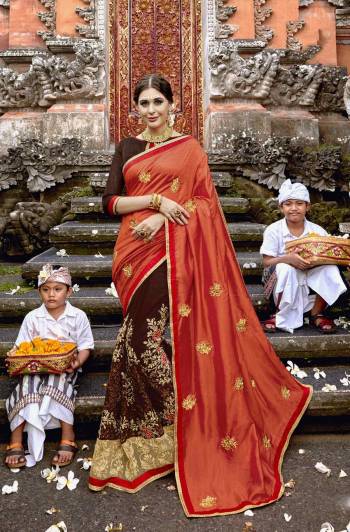 Celebrate This Festive Season wEaring This Designer Saree In Orange And Brown Color Paired With Brown Colored Blouse. This Saree Is Fabricated On Art Silk And Georgette Paired With Art Silk Fabricated Blouse. It Is Beautified With Heavy Embroidery All Over.