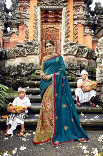 You Will Definitely Earn Lots Of Compliments Wearing This Designer Saree In Blue And Light Brown Color Paired With Light Brown Colored Blouse. This Saree IS Fabricated On Art Silk Paired With Art Silk Fabricated Blouse. It Is Beautified With Heavy Embroidery All Over.