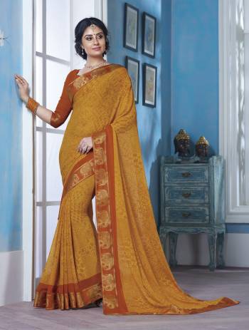 Add This Pretty Saree In Yellow To Your Wardrobe Paired With Contrasting Rust Orange Colored Blouse. This Saree And Blouse Are Fabricated On Georgette Beautified With Prints And Lace Border. It Is Light Weight And Easy To Carry All Day Long.