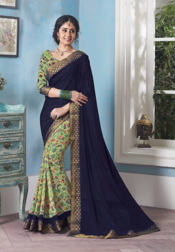 Enhance Your Personality Wearing This Saree In Navy Blue And Light Green Color Paired With Light Green Colored Blouse. This Saree And Blouse Are Fabricated On Georgette Which Looks Elegant And Make You Earn Lots Of Compliments.