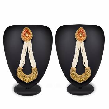 Simple, Rich And Elegant Looking Designer Pair Of Earrings Is Here In Golden Color With Stone And Moti. It Is Light Weight And Easy To Carry Throughout The Gala.