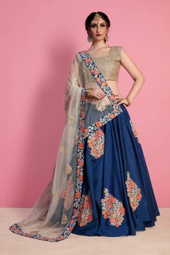 Grab This Designer Semi-Stitched Lehenga Choli In Beige Colored Blouse Paired With Dark Blue Colored Lehenga And Off-White Colored Dupatta. Its Blouse And Lehenga Are Fabricated On Art Silk Paired With Net Fabricated Dupatta. This Elegant Looking Lehenga Choli Will earn You Lots Of Compliments From Onlookers.