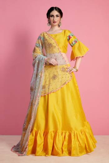 Bright And Appealing Color Is Here With This Designer Lehenga Choli In Yellow Color Paired With Contrasting Grey Colored Dupatta. Its Blouse And Lehenga Are Fabricated On Art Silk Paired With Net Fabricated Dupatta. Buy Simple Lehenga Choli With Attractive Dupatta.