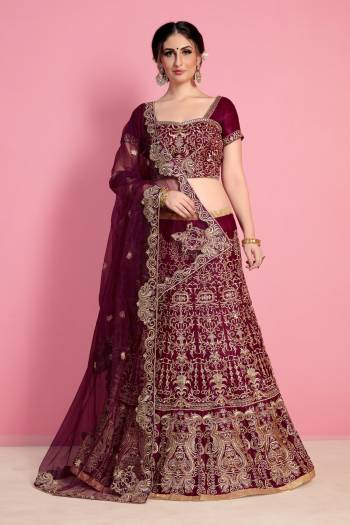 New And Unique Shade Is Here With This Designer Lehenga Choli In Wine Color Paired With Wine Colored Dupatta. This Legenga Choli Is Fabricated On Velvet Silk Paired With Net Fabricated Dupatta. Buy This Lehenga Choli Now.