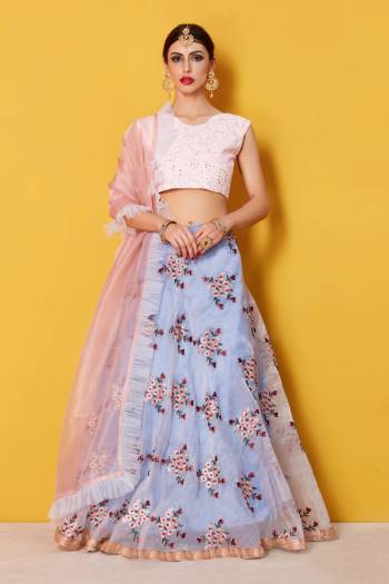 This beautiful grey organza lehenga with peach off-shoulder chikankari work blouse. Organza dupatta with frill cornerd grey net is a delight for the eyes with its pastel color palette.