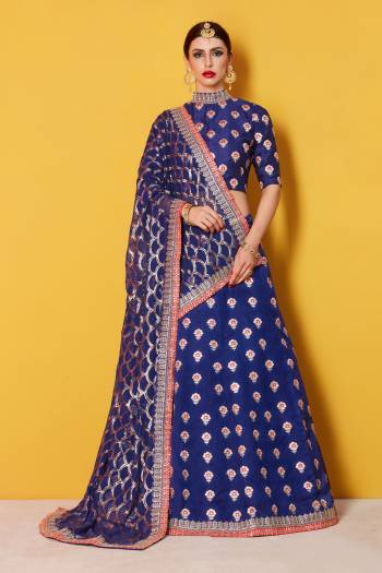 This set features a navy blue semi art silk zari work lehenga choli set. It comes along with zari and dori lace work on dupatta and heavy embroidery sequins work on dupatta. Matching blouse with heavy zari work butti.