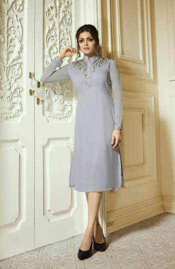 Flaunt Your Rich And Elegant Taste Wearing This Designer Readymade Kurti In Grey Color Fabricated On Georgette Beautified With Embroidery Over Its Yoke Neck. Buy Now.