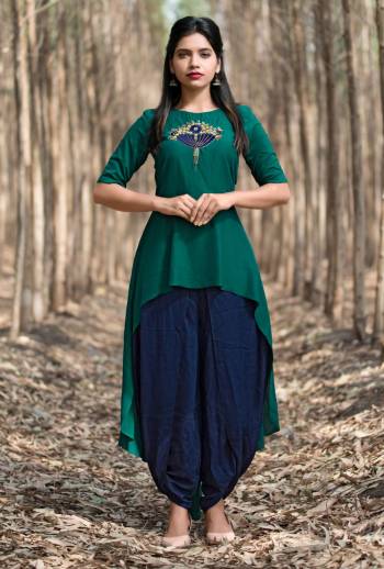 Teal Green & Navy Blue Color Muslin fabric kurti with bottom . This up to down handworked indo-western style kurti can be a perfect outfit for every occasion, Be it a festival or any function. Moreover, they are ideal attire for office going or college going girls. Buy this lovely kurti now.