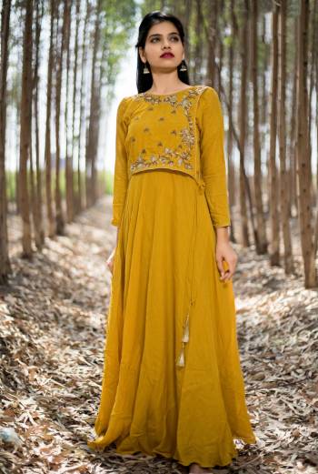 Mustard Yellow Color Muslin Silk Fabric Kurti. This kurti featuring of Floral  Zardosi Handwork On Yoke . This attractive kurta will surely fetch you compliments for your rich sense of style.