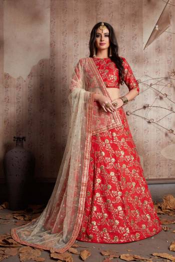 This set features a red sleeves blouse in raw silk base with floral gold zari & sequins embroidery all over. It is paired with matching gold embroidered red raw silk flared lehenga. It comes along with cream net dupatta with gold lace all over.