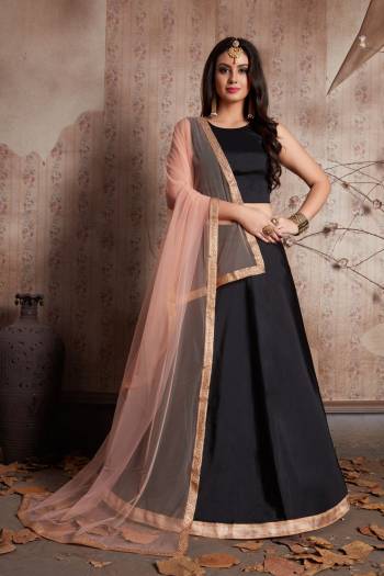 Featuring a jade black pure lavished in taffeta silk. It comes along with soft net dupatta cornered with lacework. Its tassels are in peach color giving an amazing twist to the blouse. Back of the blouse is normal U-Shaped. 