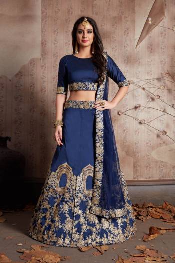 This set features a dark Navy blue art silk dori work lehenga choli set. It comes along with stone and dori lace work on dupatta and heavy embroidery work on lehenga. Matching blouse with short sleeves.