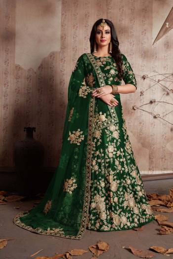 This set features a Dark  green velvet dori work lehenga choli set. It comes along with lace work dupatta and heavy embroidery on dupatta's net. Matching blouse with heavy dori dori work.Looks completely heavy work.