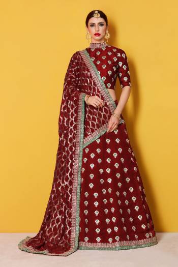 This set features a Maroon Art silk zari work lehenga choli set. It comes along with zari and dori lace 
work on dupatta and heavy embroidery sequins work on dupatta. Matching blouse with heavy zari work butti.