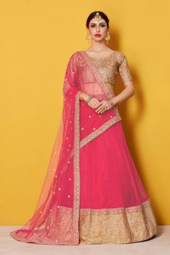 Featuring a scoop neck sequinned glitter blouse and a solid color net lehenga with a matching Pink shantoon interlining. The lehenga has a 9