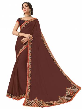 Presenting this brown color moss chiffon saree. Ideal for party, festive & social gatherings. this gorgeous saree featuring a beautiful mix of designs. Its attractive color and designer heavy embroidered design, Flower patch design, stone design, beautiful floral design work over the attire & contrast hemline adds to the look. Comes along with a contrast unstitched blouse.