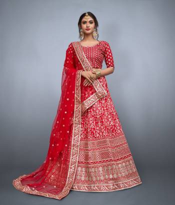 This set features red floral resham work with sequins embellished on it. It comes along with matching red blouse and sequins embellished on it. It is paired with soft net butti work in sequins and heavy lace work on it.