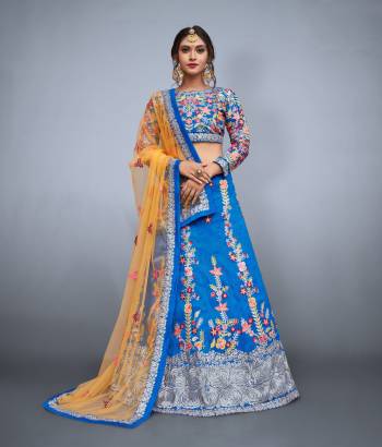 Celebrate your close one's wedding day by wearing this beautiful bridesmaids lehenga.Fashioned out of banglori silk fabric and colored in yale blue color this lehenga is embellished with resham,sequins,zari embroidery which will definitely make your heart melt. Enchant your surrounding by dressing up in this masterpiece which has been designed keeping in mind today's fashion. Available with yale blue color raw silk embroidered blouse peice and a chrome yellow color soft net dupatta.