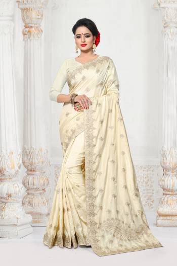 Simple And Elegant Looking Designer Saree In Here In Off-White Color Paired With Off-White Colored Blouse. This Saree And Blouse are Fabricated On Art Silk Beautified With Jari Embroidery And Stone Work.