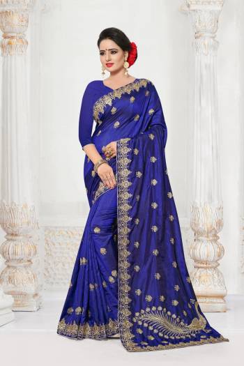 Shine Bright Wearing This Saree In Royal Blue Color Paired With Royal Blue Colored Blouse. This Saree And Blouse are Fabricated On Jari Embroidery With Stone Work With An Attractive Peacock Motif Over The Pallu.