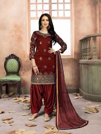 Grab This Amazing Designer Salwar Suit In Maroon Color Paired With Maroon Colored Bottom And Dupatta. Its Top Is Fabricated On Art Silk Paired With Santoon Bottom And Net Dupatta. It IS Beautified with Jari Embroidery And Mirror Work. Buy Now.