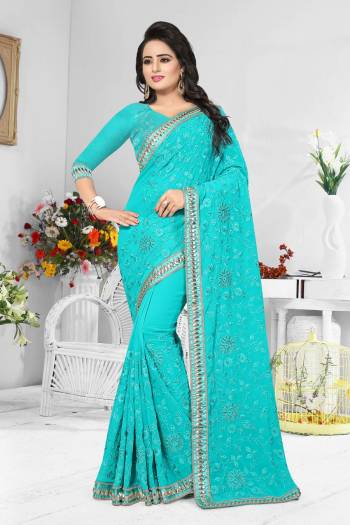 Grab This Pretty Shade In Blue With This Turquoise Blue Colored Saree Paired With Same Blouse. It Is Fabricated On Georgette Beautified With Heavy Same Tone Resham Embroidery.