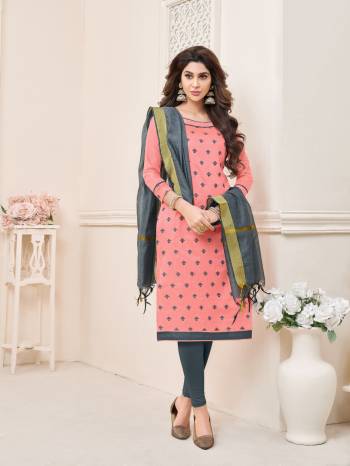 Look pretty wearing this dress material in peach colored top paired with contrasting dark grey colored bottom and dupatta. Its top and bottom are fabricated on cotton paired with chanderi dupatta. It has very pretty small thread embroidered motifs all over it.