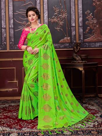 Look attractive wearing this saree in parrot green color paired with contrasting rani pink colored blouse. This saree is fabricated on faancy silk paired with jacquard silk fabricated blouse. Buy this Saree now.