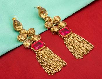 For An Attractive Look, Grab This Pretty Set Of Earings In Golden Color Beautified With Pink And Beige Colored Stone Work. Buy This Earring Set Now.