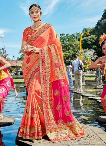 A must have shade in every womens wardrobe is here with this pretty designer saree in peach color paired with orange colored blouse. This saree and blouse are fabricated on art silk beautified with heavy embroidery all over.