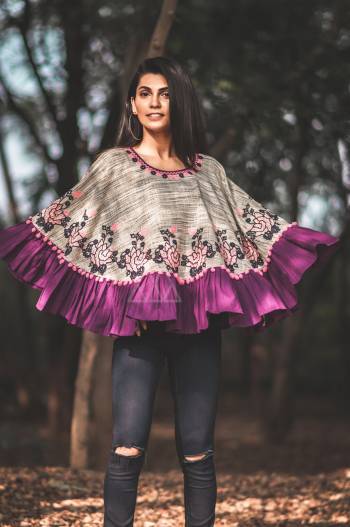 Front & back Floral embroidery ponchoon khadi cotton fabric,  embilished with pom pom lace and zig zag lace on neck. Attached with purple frill all over the poncho 