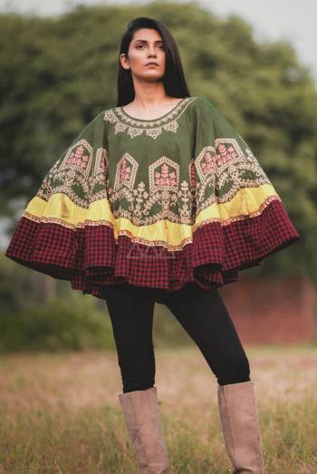 Temple window embroidered poncho on Olive green khadi fabric embilished with jute multi lace. Aattched with lemon yellow and red chex frill all over the poncho