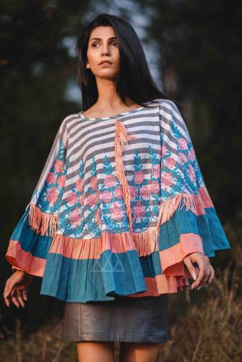 lining floral embroidered poncho with tassel lace embilished in frill and in front joint. Attached with laternate color frill all over the poncho