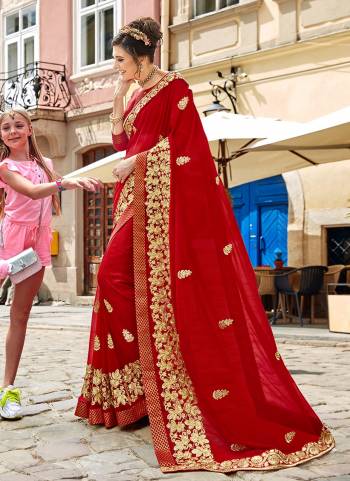 Adorn The Pretty Angelic Look Wearing This Designer Saree In Red Color Paired With Red Colored Blouse. This Saree Is Georgette Base Fabric Paired With Art Silk Fabricated Blouse, It Is Light Weight And Easy To Carry All Day Long. 