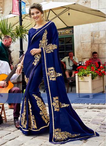 Enhance Your Personality Wearing This Designer Saree In Blue Color Paired with Blue Colored Blouse. This Georgette Based Saree Is Paired With Art Silk Fabricated Blouse. It Has Elegant Embroidery Giving A Rich Look To Your Saree.