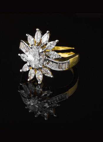 Give A Very Pretty Look To Your Soft Beautiful Hands With This Lovely Designer Ring In Golden Color Beautified With Lovely Diamond Work. This Pretty Ring Can Be Paired With Any Colored Attire. Buy Now.