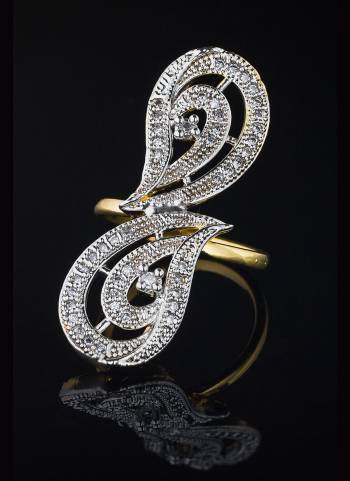 Give A Very Pretty Look To Your Soft Beautiful Hands With This Lovely Designer Ring In Golden Color Beautified With Lovely Diamond Work. This Pretty Ring Can Be Paired With Any Colored Attire. Buy Now.