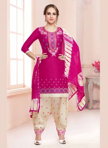 Shine Bright In This Attractive Dark Pink Colored Dress Material Paired With Cream Colored Bottom. Its Top And Bottom Are Fabricated On Cotton Paired With Chiffon Dupatta. Buy This Dress Material Now.